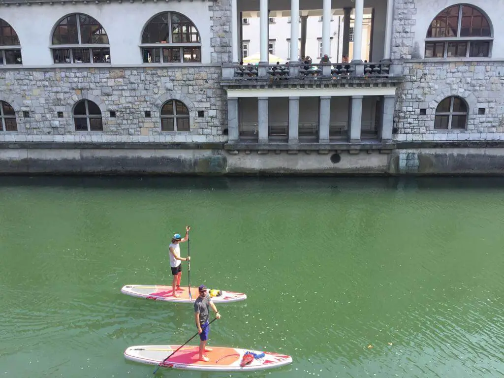 Ross and Chris SUP through the centre of Ljubljana.JPG