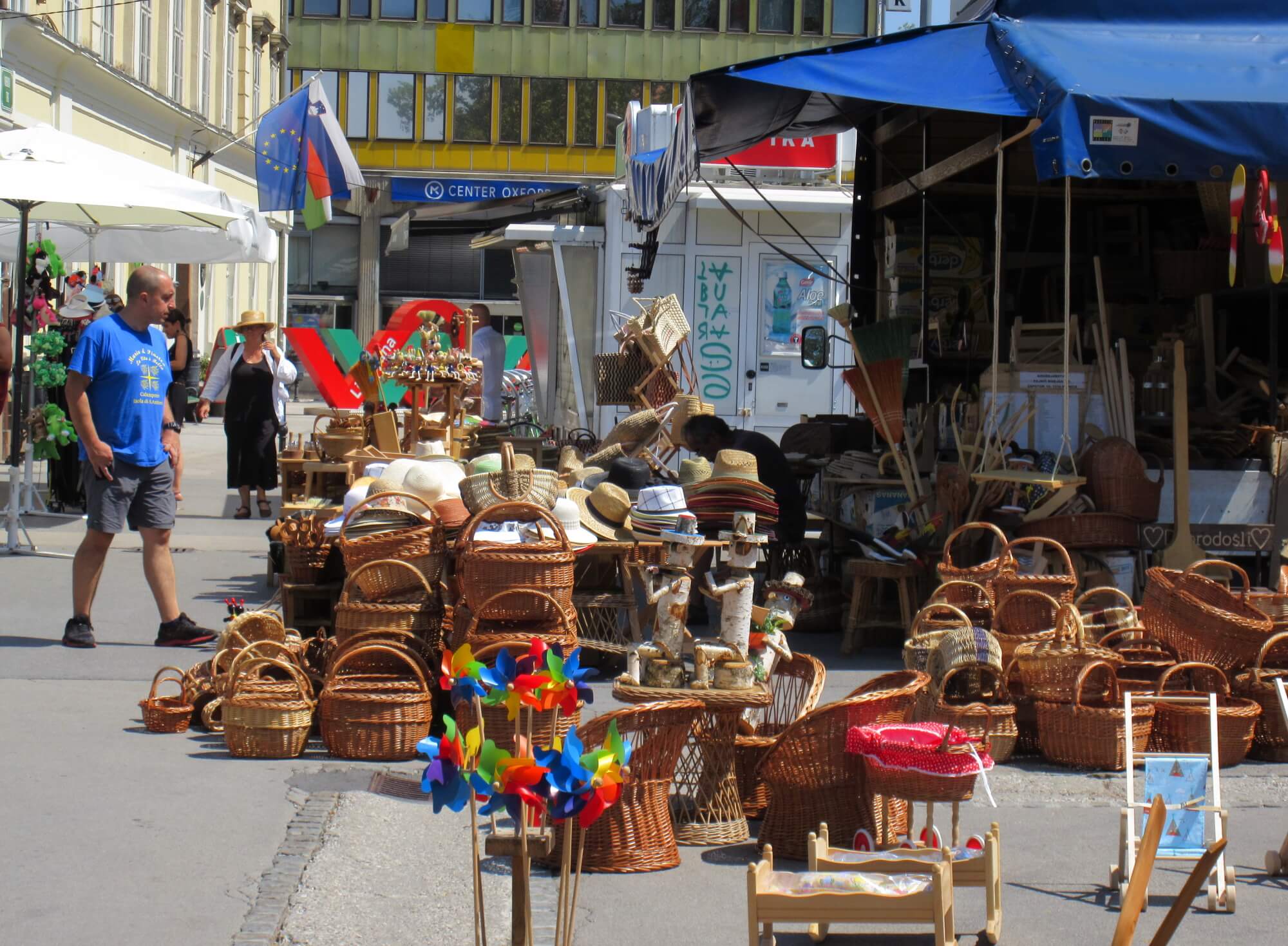 jl flanner august 2019 ljubljana market hats summer.jpg