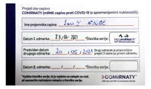 Card marked for having the first dose
