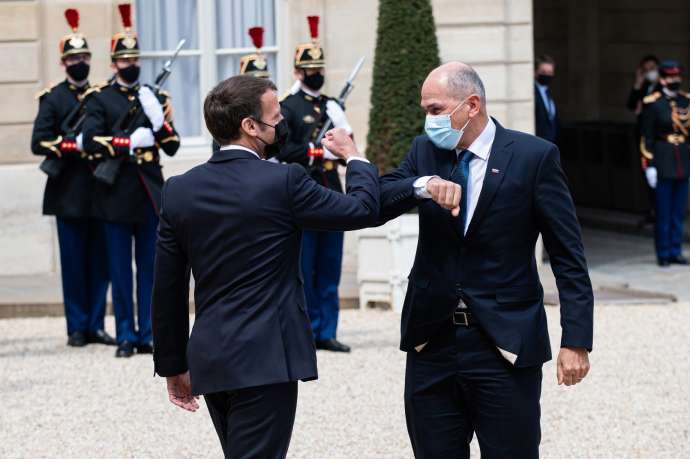 President Macron and Prime Minister Janša bump elbows in Paris