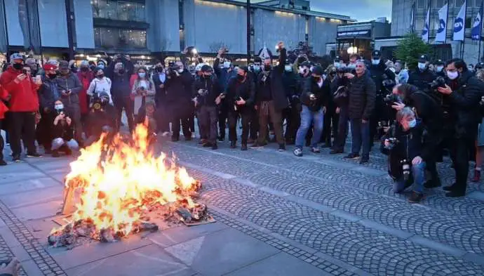 Protesters Light May Day Bonfire in Front of Parliament
