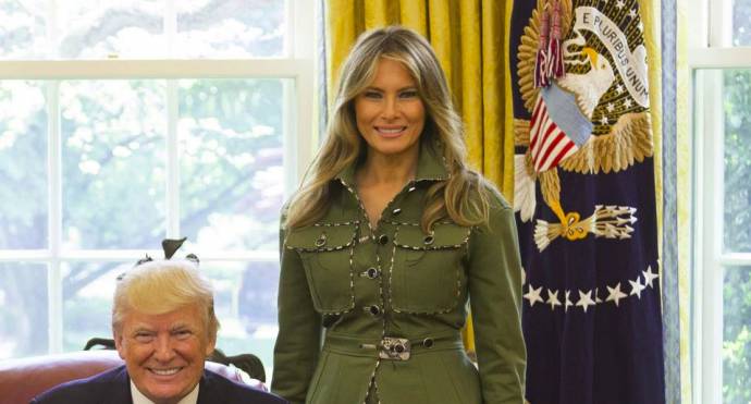 President Donald Trump and First Lady Melania Trump pose for photos, Thursday, April 27, 2017 in the Oval Office of the White House in Washington, D.C. Cropped image.
