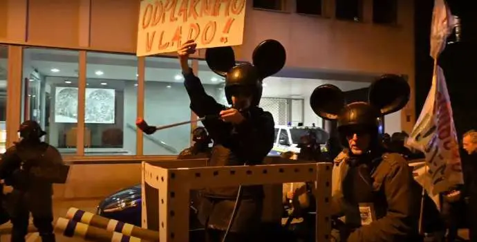 Two protestors, in costume