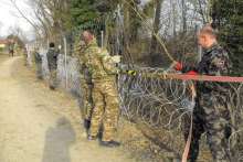 The Slovenian Army putting up a border fence in 2016