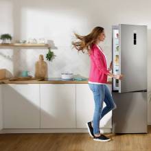 A woman enjoy's one of Gorenje's refrigerators