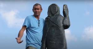 A man who looks like Aleš Župevc, who handmade the original sculpture