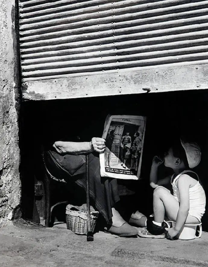 Reading a newspaper in Madrid, 1964