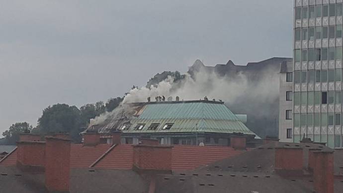 Smoke pours from the hotel